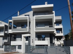 Detached maisonette with basement and attic and a two-storey apartment building