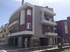 Three-storey building with pilotis